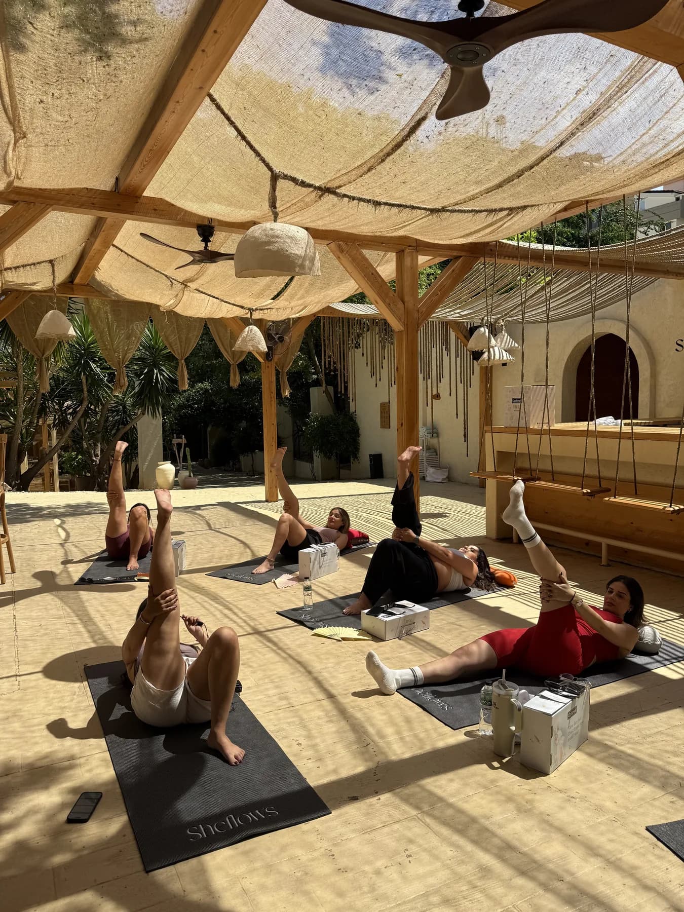 Participants practising prenatal yoga at a SheFlows event