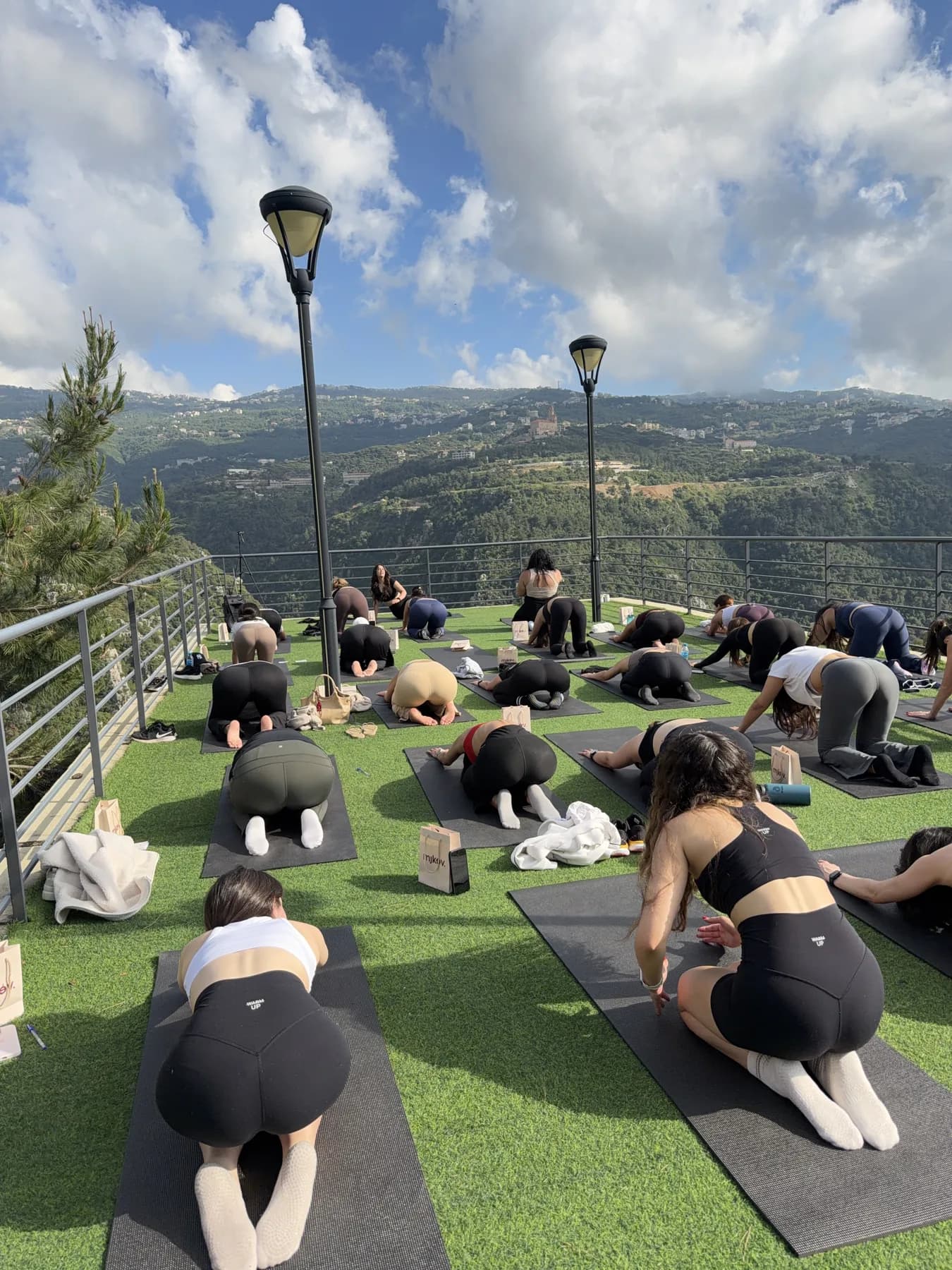 Outdoor yoga overlooking the mountains at Scappa